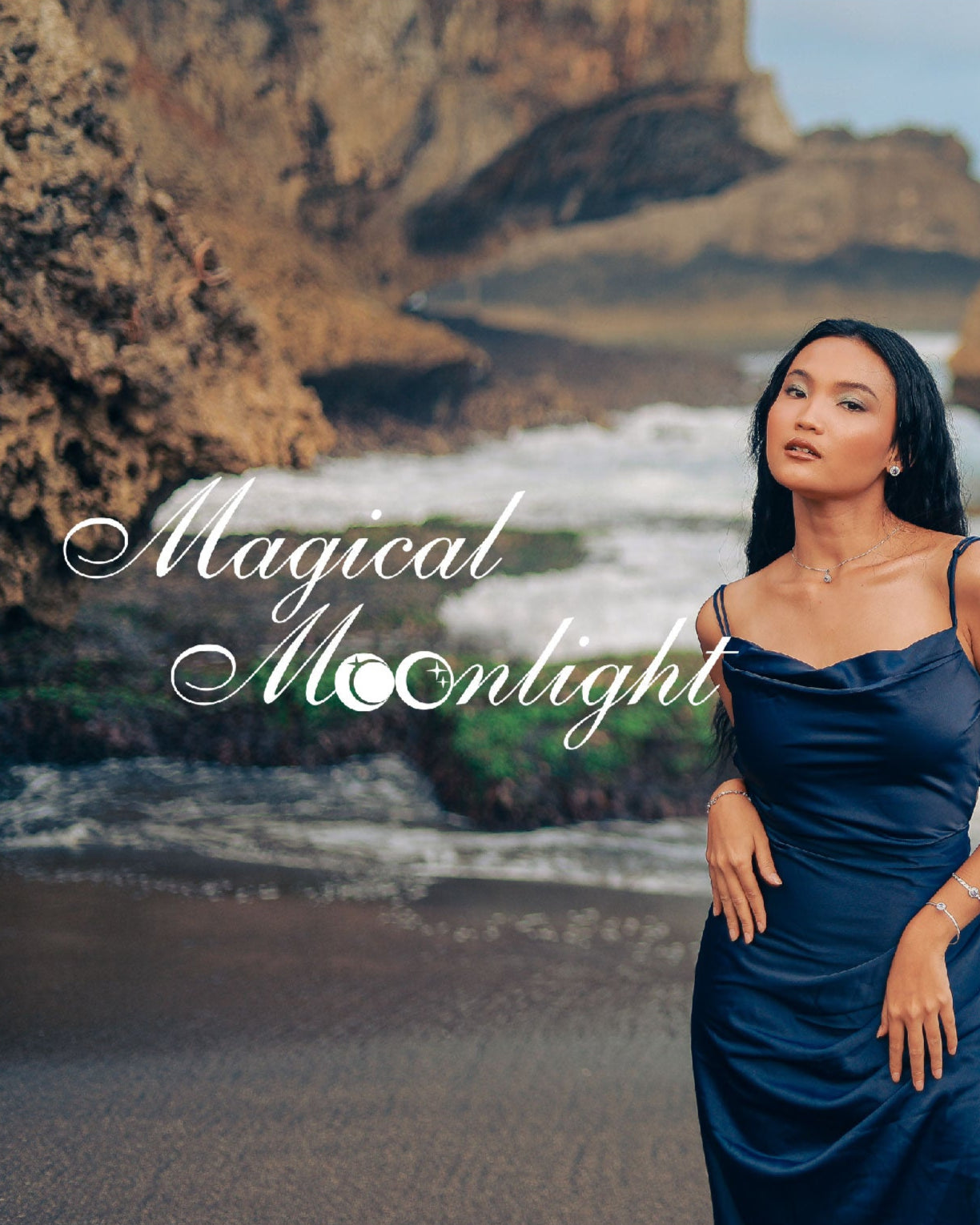 Woman in a blue dress standing on a rocky beach with the text 'Magical Moonlight'.